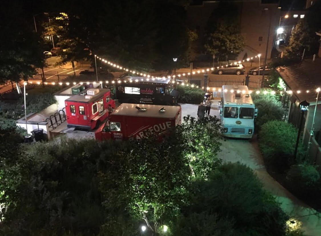 Food trucks and lights in the West Plaza