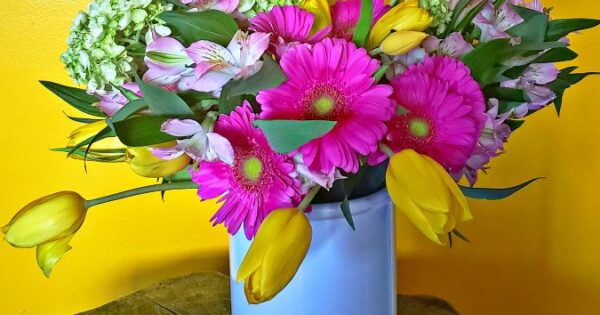 Flower arrangement with colorful flowers and greenery
