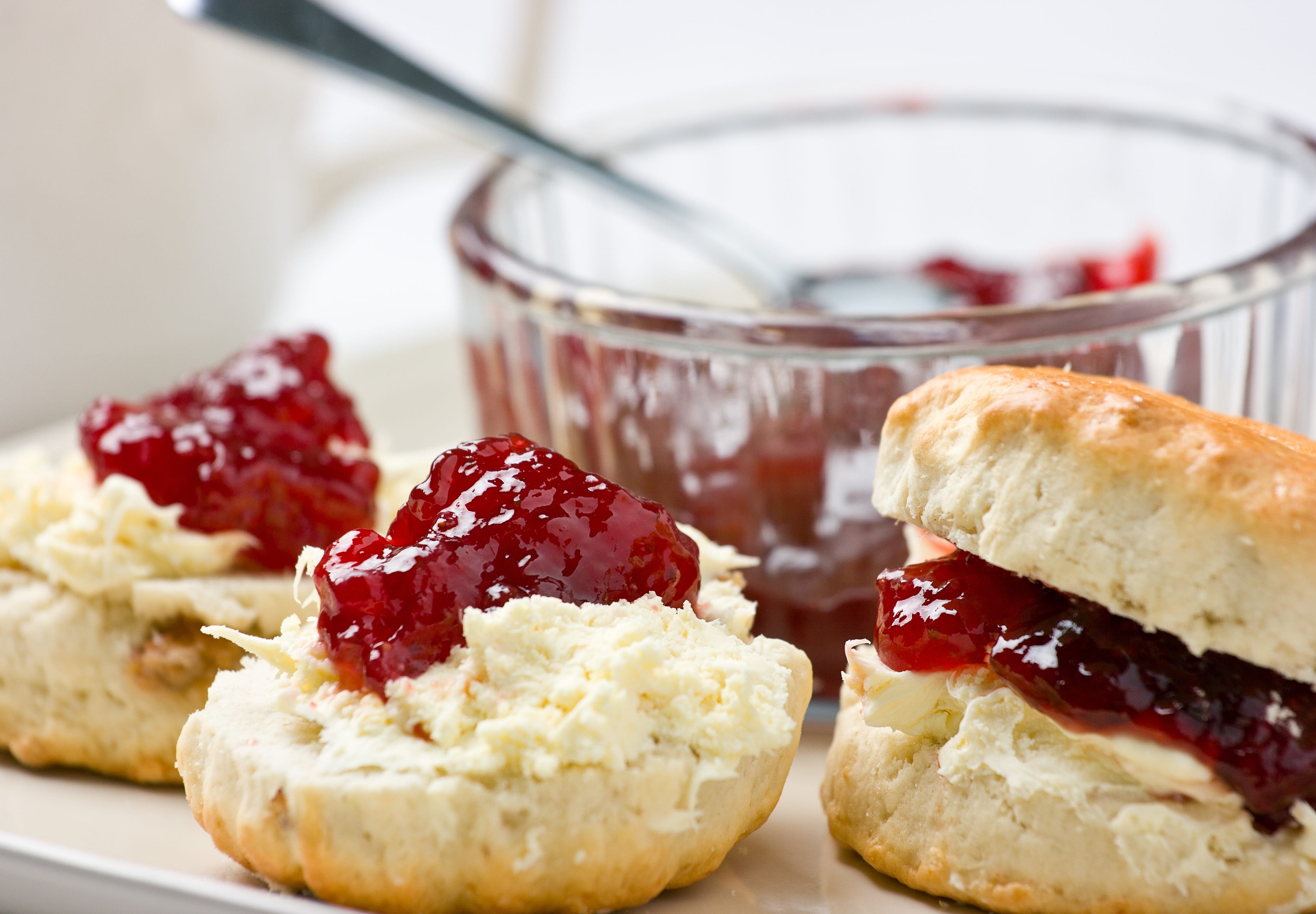 Home-baked scones with strawberry jam and clotted cream.